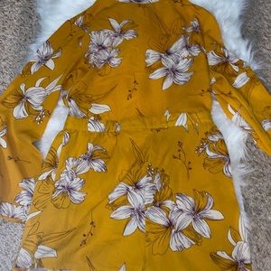 Backless, long sleeve romper ONLY WORN ONCE.